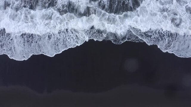 Drone shot, from above, surf at the beach of Praia de Santa Barbara, Ribeira Grande, Sao Miguel Island, Azores, Atlantic Ocean, Portugal