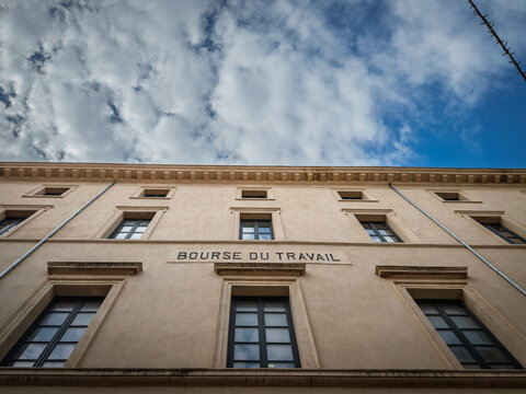 Low-angle view of the Bourse du Travail, labor exchange in french, in toulon, a building linked to French trade unions, workers organizations and history of labor representation and collective action.