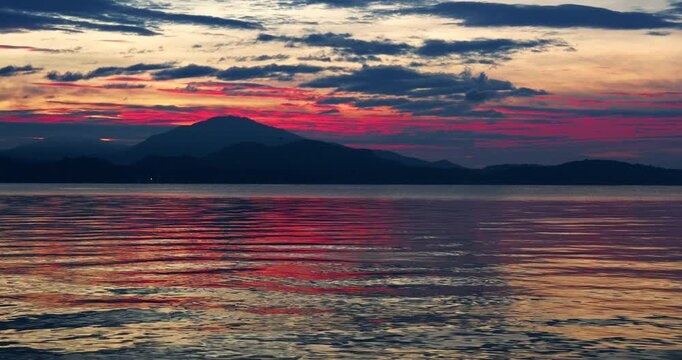 Spectacular red sunrise over lake Maggiore