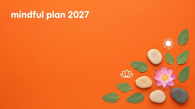Mindful plan 2027 strategy concept with wellness elements on orange fabric background featuring lotus flower stones and leaves for wellness presentation cover