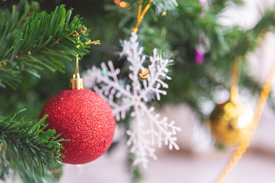 Background Christmas tree decorated holiday winter xmas celebration present gift decorate bauble ornament golden ball in cozy living room. Merry Christmas happy new year festival traditional concept