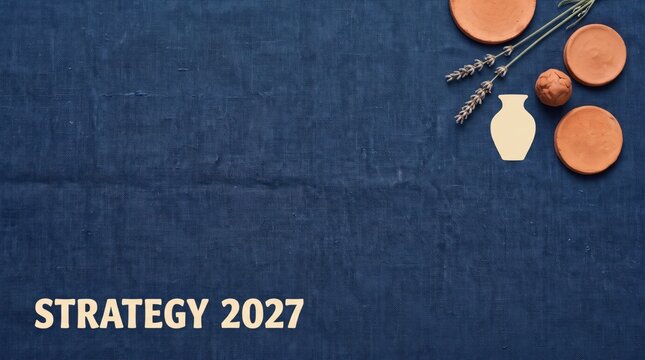 STRATEGY 2027 business planning template featuring dark blue linen fabric texture background with pottery clay objects and lavender sprigs in top corner and ample copy space on the left