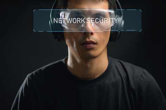 Young Man Wearing Headphones and Glasses with Transparent Network Security Display