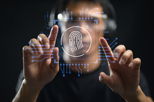 Futuristic Person Engaging with Biometric Fingerprint Scanner Interface in Dark Environment
