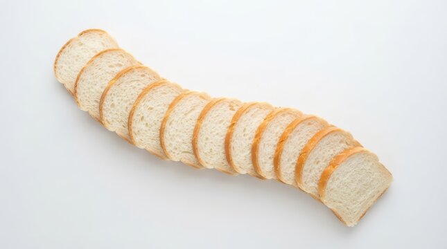 A row of fresh white bread slices arranged in a curved line isolated on white background