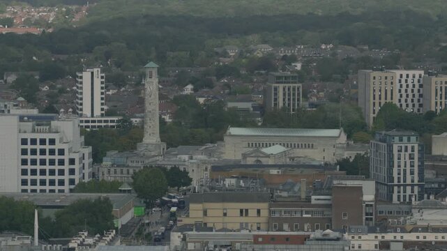 Telephoto aerial view across Southampton city centre showing the Civic Centre clock tower Guildhall surrounding offices residential buildings and urban landscape