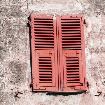 Closed red shutters, Corsica, France