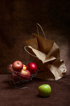 Crumpled paper bag and ripe apples