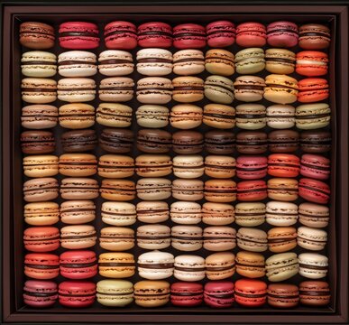 Close-up of a variety of colorful French macarons. Macarons are small, round cookies made with almond flour, sugar, and egg whites. They come in a wide variety of flavors and colors.