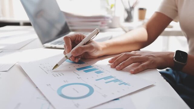 Closeup of the hands of a receptionist typing and sending emails while working in an office alone. One secretary doing admin and writing reports while organizing a schedule for her manager at work