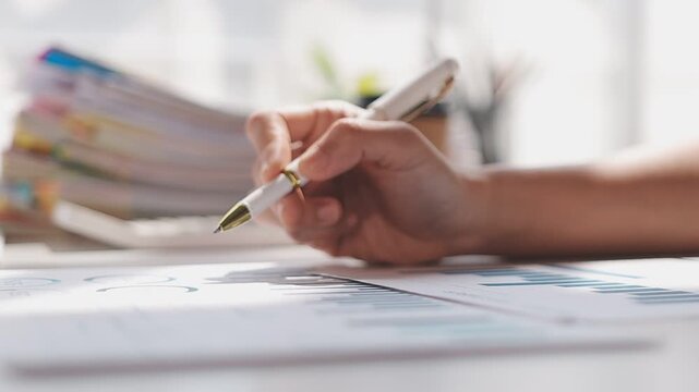 Closeup of the hands of a receptionist typing and sending emails while working in an office alone. One secretary doing admin and writing reports while organizing a schedule for her manager at work
