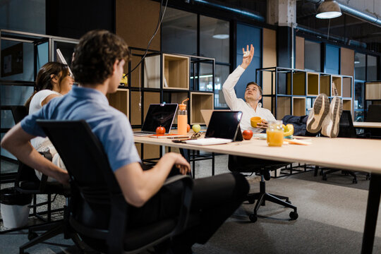 Colleagues take a relaxed break in a modern office