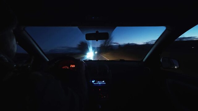 Timelapse of driving car interior POV on road at night dusk twilight