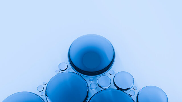 Blue spherical bubbles clustered on a light surface