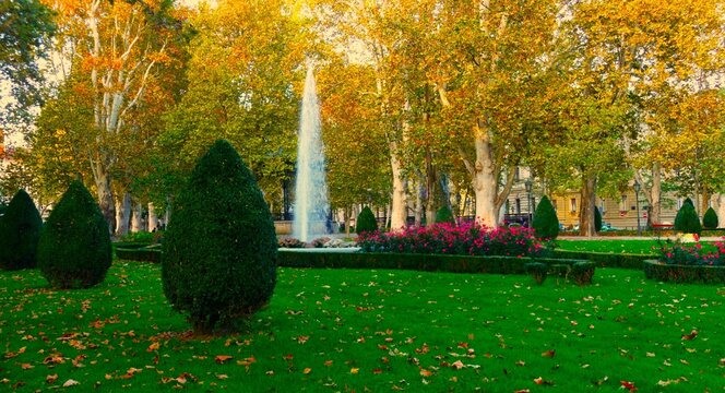 City park with flower, trees and fountain in autumn season with promenade, and colorful landscape, Zagreb, Croatia