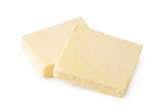 Two blocks of pale yellow cheese isolated on a white background