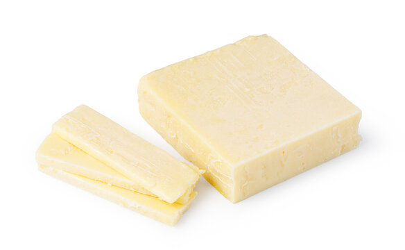 Pale cheese block with sliced pieces isolated on a white background