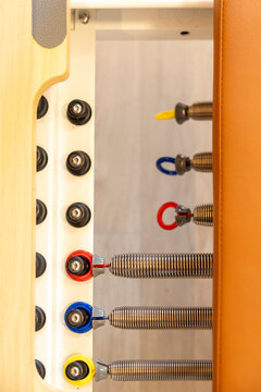 Pilates reformer resistance springs and color-coded attachment loops