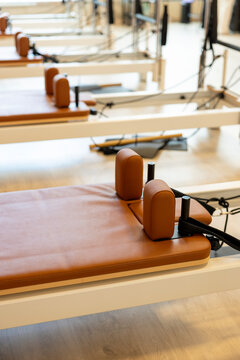 Pilates reformer machines in a bright fitness studio