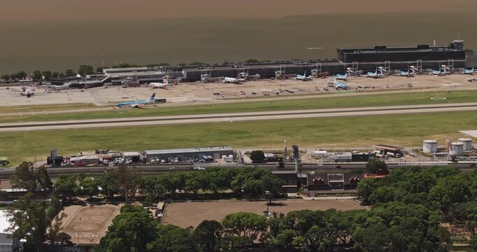 Buenos Aires Argentina Aerial v31 zoomed telephoto view of Aeroparque Jorge Newbery runways, terminal, aircraft and Costanera Norte - Shot with 5k Camera - Jan 3rd 2026