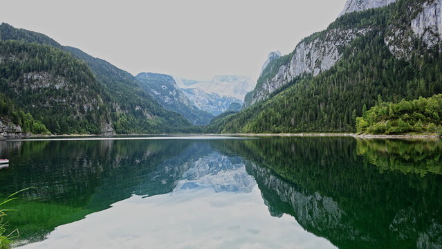 Nature landscape. Lake in scenic nature. Scenic nature and hiking lake. Mountain forest. Green forest. Silent wilderness. Lake with mountain landscape. Landscape of mountain and forest lake