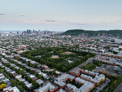 Aerial view of Parc Pere Marquette and La Baraque in Montreal with city blocks and Mount Royal. g.