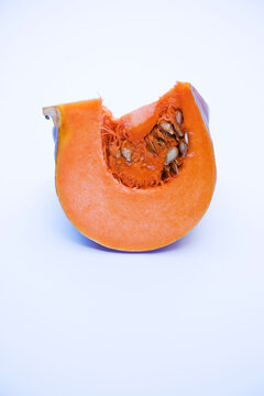 Pumpkin Wedge with seeds isolated on white background