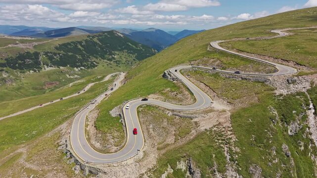 Traffic Climbing Upper Transalpina Switchbacks