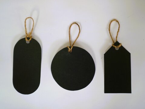 Black paper labels or tags on white background