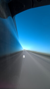 Vertical Long Exposure Car on Road at Bright Horizon