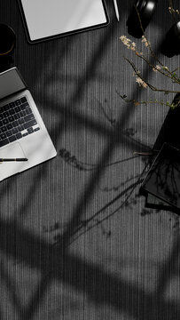 3D Illustration Top View Dark Office Workspace Flat Lay with Laptop, Tablet, Headphones and Floral Branch Shadows