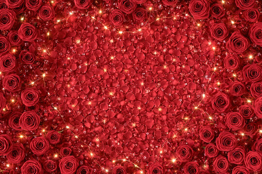A stunning romantic background featuring a heart shaped arrangement of vibrant red rose petals surrounded by lush red roses and sparkling fairy lights creating a dreamy love filled atmosphere