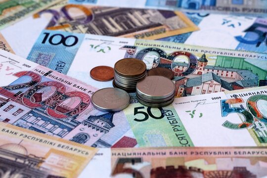 Belarusian ruble money notes and coins on table. Belarus cash bills of BYN currency close up