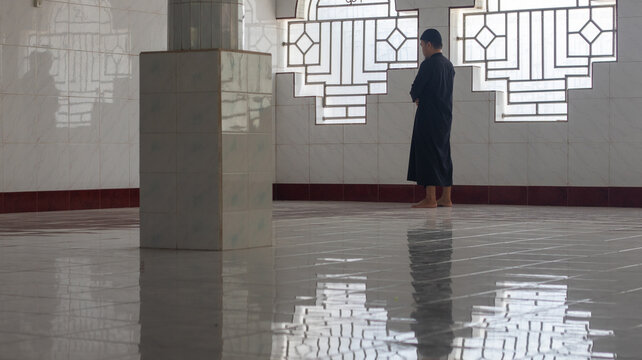 Muslim Man Praying Inside a Mosque