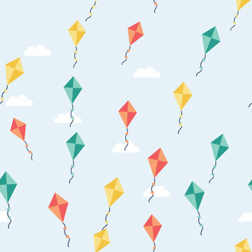 Seamless spring pattern with colorful kites and clouds