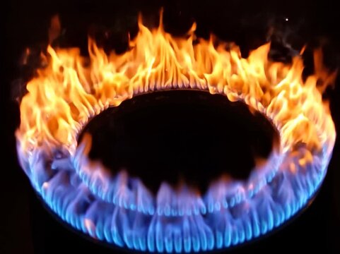 Circular ring of orange and blue flames burning against pure black background