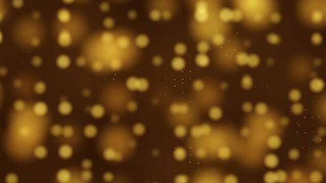 Golden bokeh lights floating on a dark abstract background