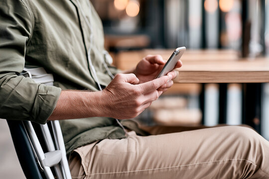 Blind Professional Using Smartphone Screen Reader at Modern Cafe