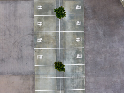 Seniors accessible parking spaces in parking lot from aerial view