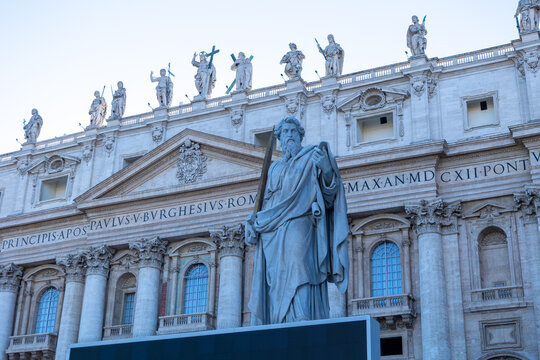 Statue of Saint Paul in front of St Peter's Basilica facade in St Peter's Square, Vatican City, Rome