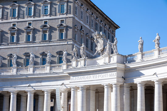 Statues on Bernini colonnade and Apostolic Palace facade at St. Peter's Square, Vatican, Rome, Italy