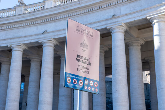 Rome, Italy - October 13, 2026: Visitors entrance sign for St Peter's Basilica in front of the colonnade in St Peter's Square, Vatican City