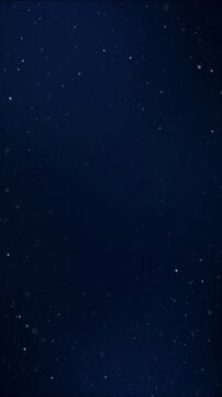 Luminous particles and tiny white stars floating gently across a deep blue gradient space, twinkling in darkness