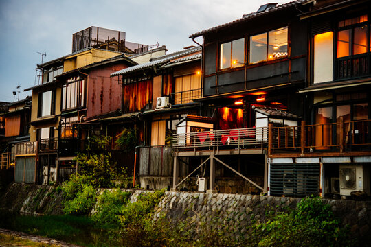 View of traditional japanese houses along Kamo-gawa river in Kyoto, Japan.