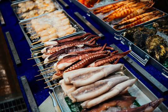 Different kinds of seafood on sale at the Kuromon Ichiba market in Osaka, Japan.