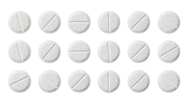 Round white scored pills with textured surface, isolated on transparent background