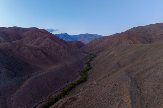 Aerial view of a winding river valley in Kyrgyzstan