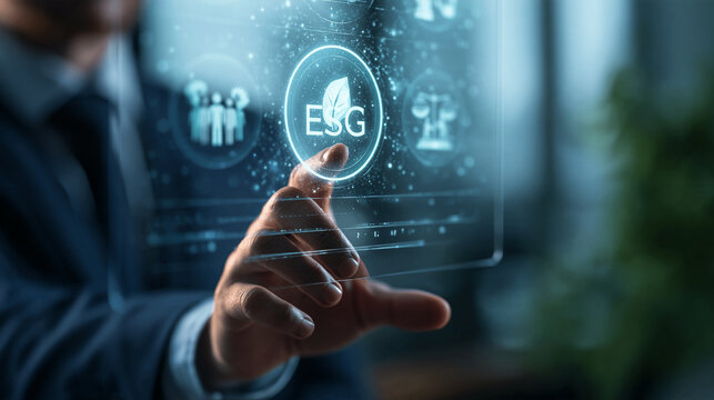 Businessman touching a glowing ESG symbol