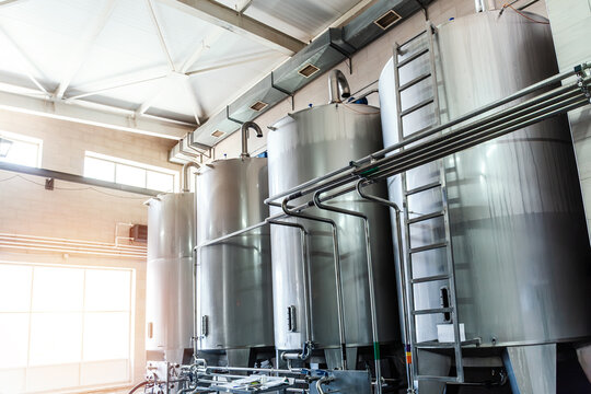 Large Stainless Steel Storage Tanks for Industrial Beverage Production, Bulk Liquid Processing and Automated Factory Manufacturing Infrastructure