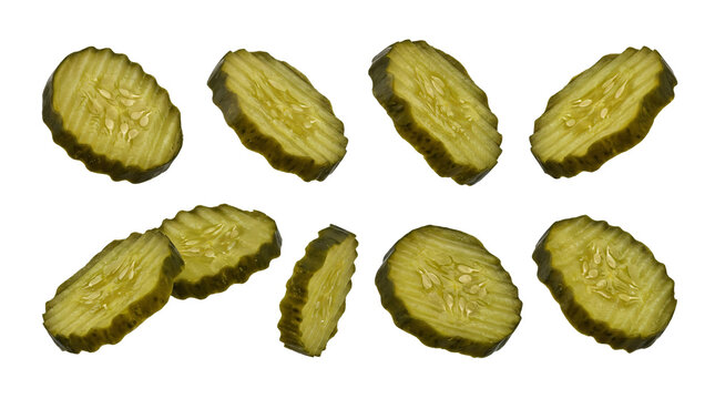 Crinkle cut dill pickle slices floating isolated in various angles on transparent background